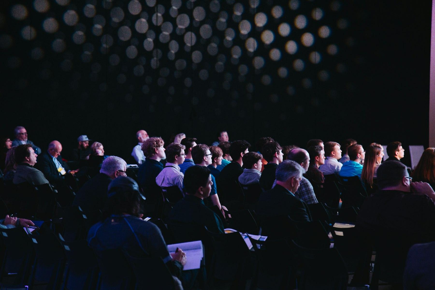 Participants seated in a conference hall
